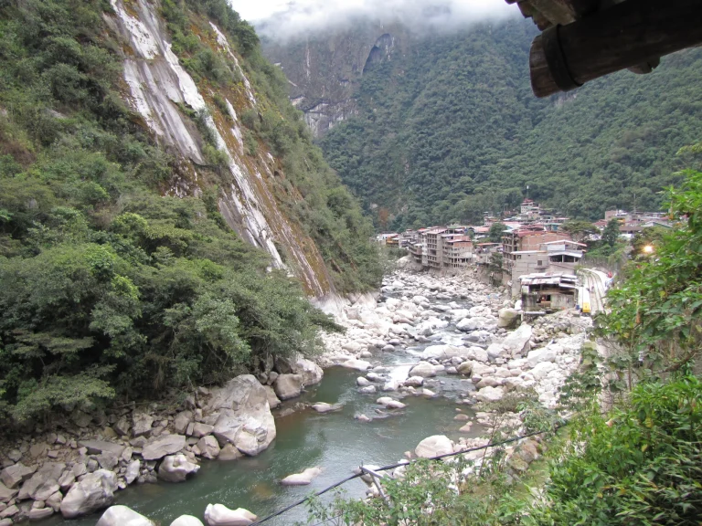Machu Picchu Pueblo, also known as Aguas Calientes, beneath steep green Andean slopes