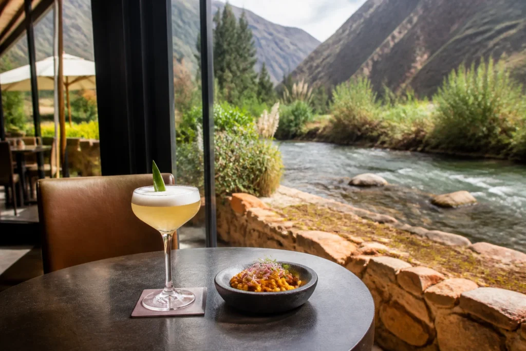 Garden seating beside the Urubamba River at El Huerto Bar