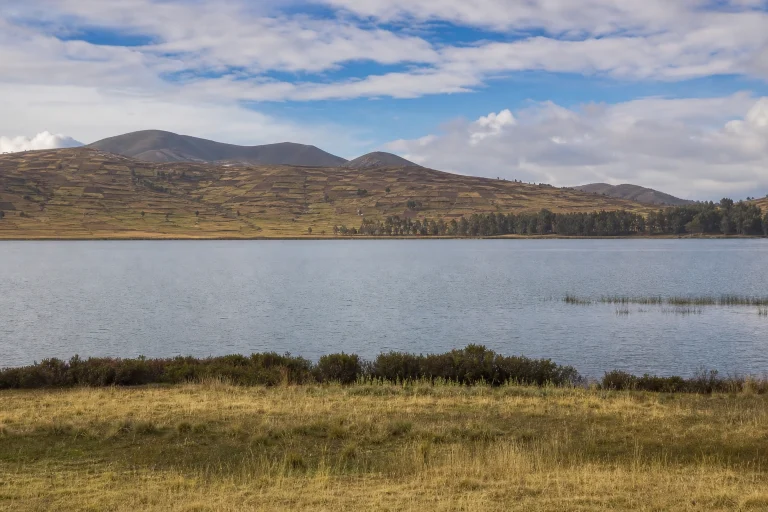 Laguna de Huaypo surrounded by high-altitude Andean countryside