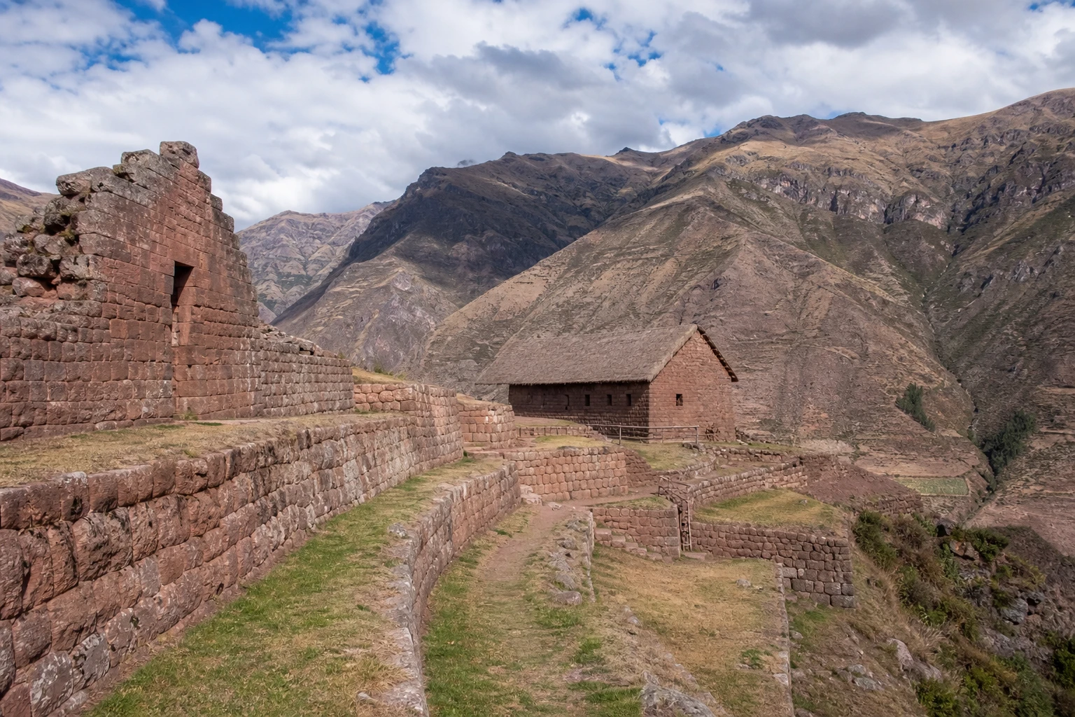 Stone archaeological structures at Huchuy Qosqo in the Sacred Valley highlands.