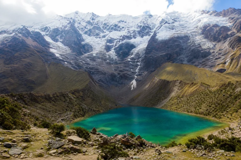 Humantay Lake surrounded by steep high-Andes mountain slopes in Peru