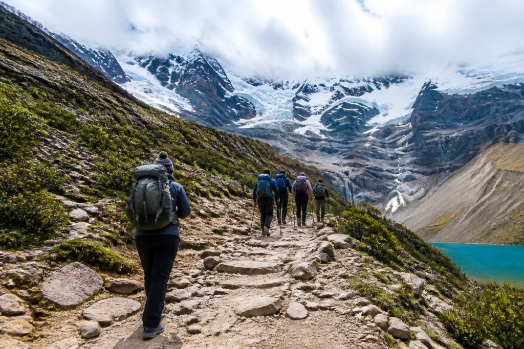 Hikers ascending the high-altitude trail toward Humantay Lake