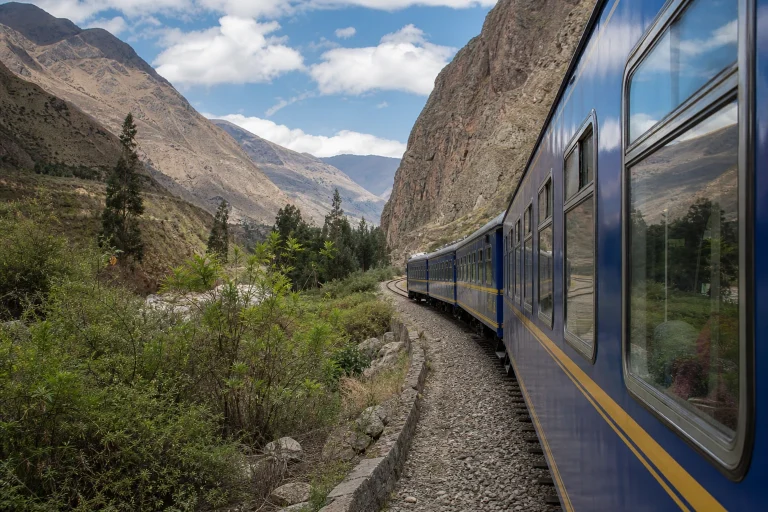 Passenger train traveling through the Sacred Valley near Ollantaytambo