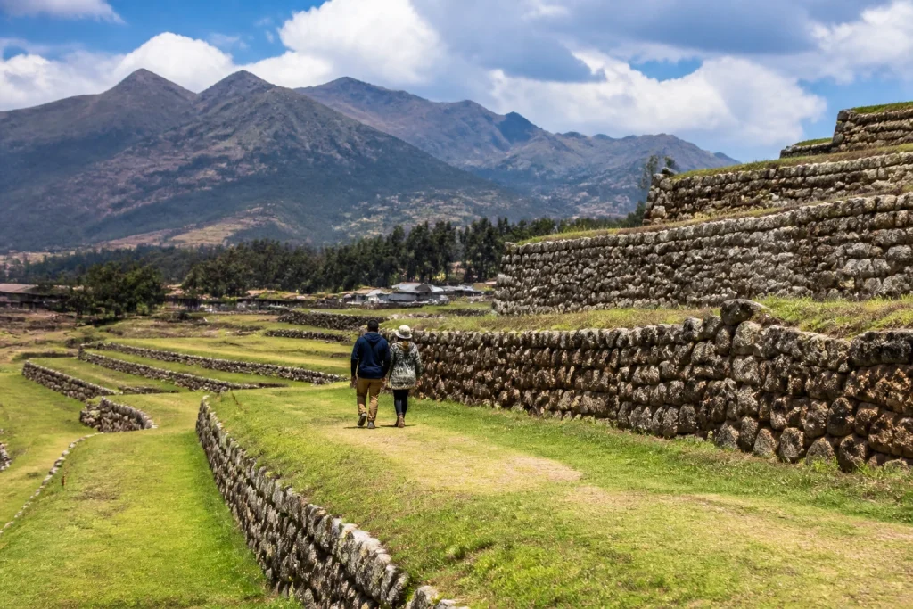 Couple walking near the historic terraces of Chinchero in the Sacred Valley