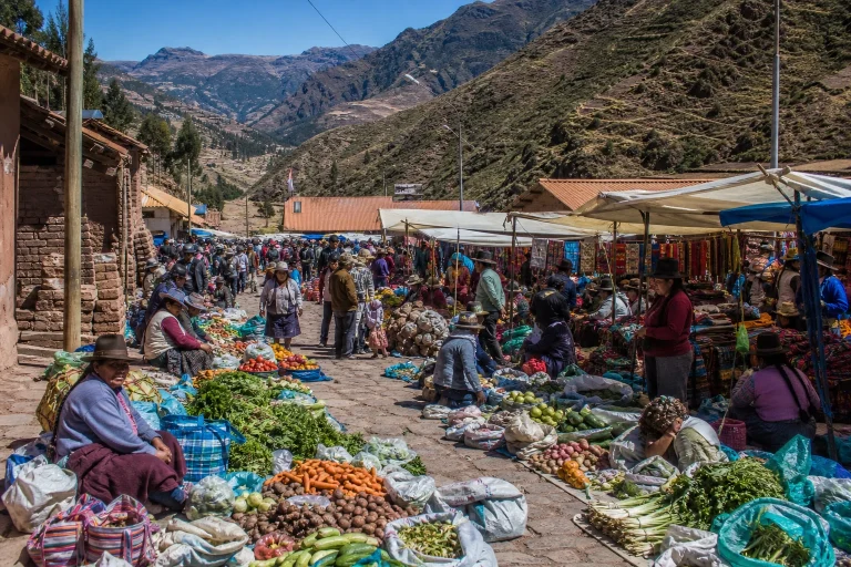 Sunday market stalls with produce and textiles at Písac Market in the Sacred Valley