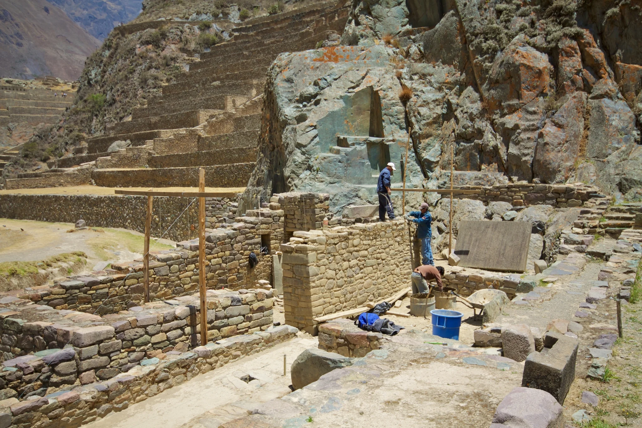 Ollantaytambo town in Peru’s Sacred Valley beneath steep valley slopes.
